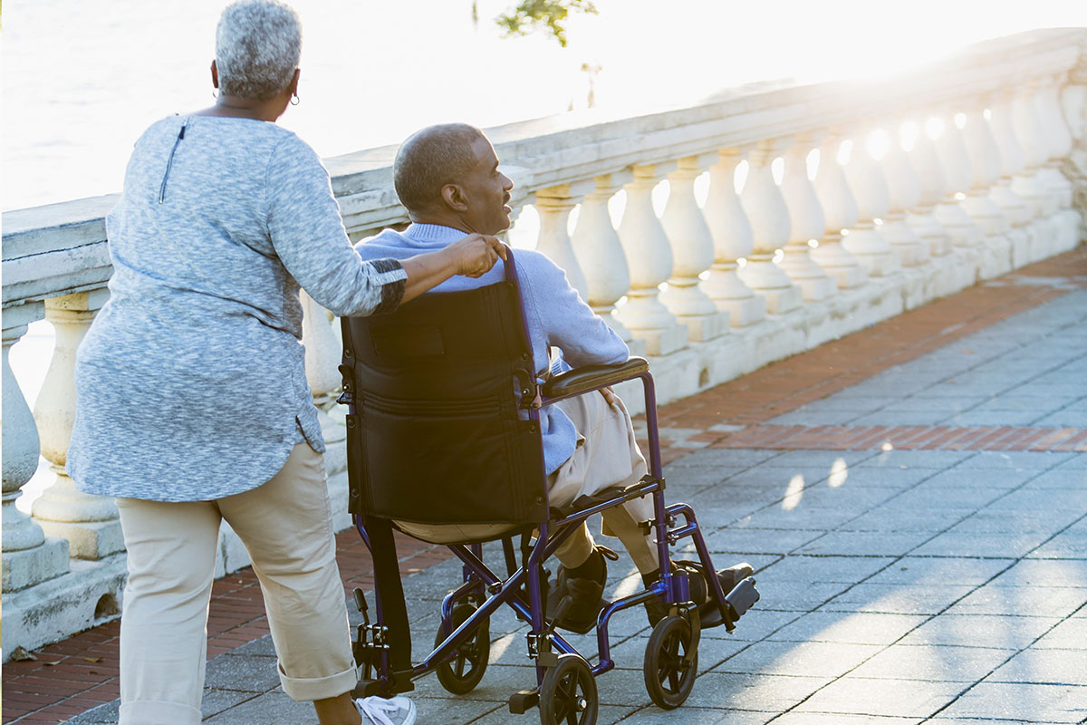 Senior African American couple, man in wheelchair