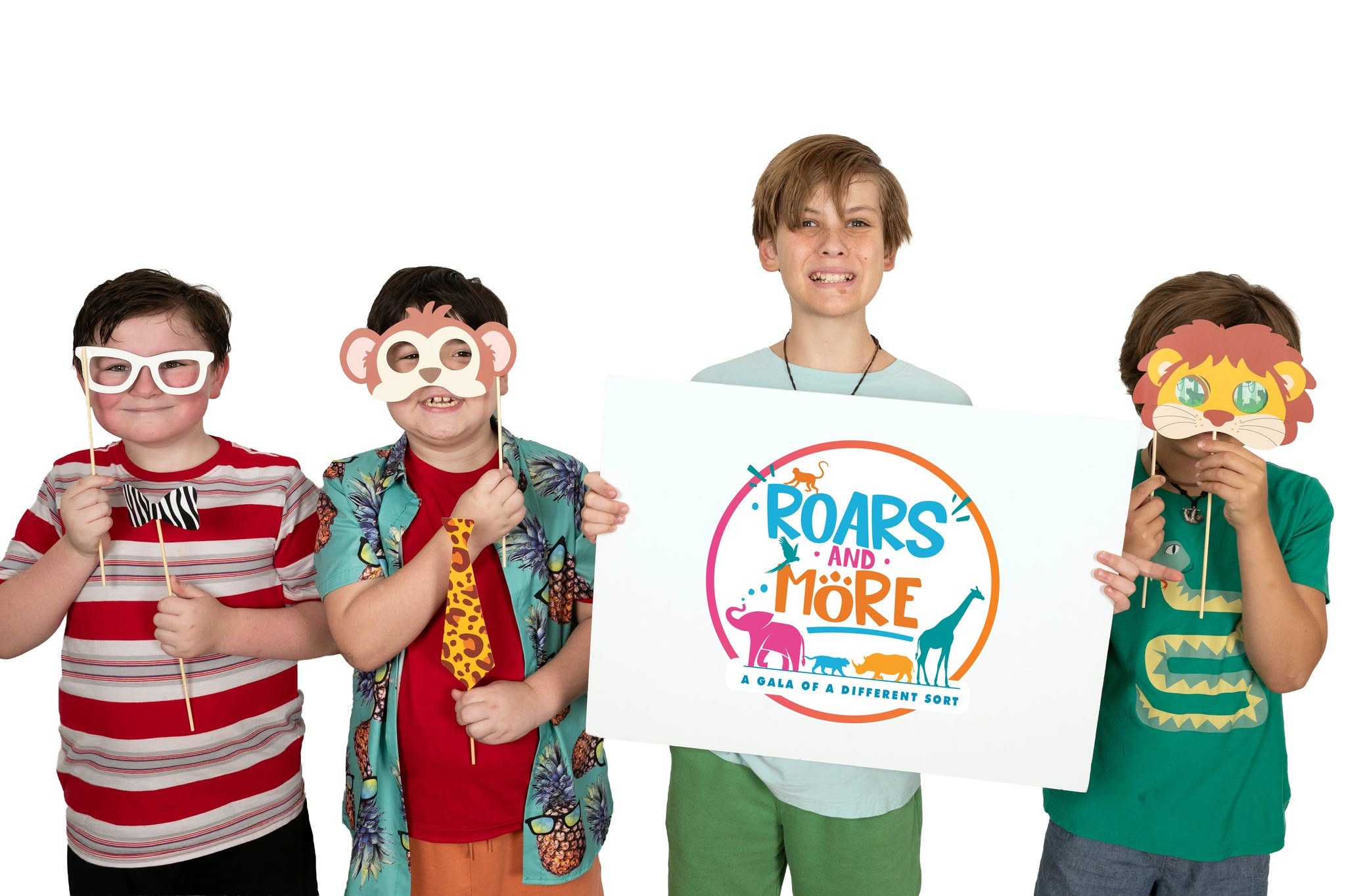 Children holding the ROARS and More sign for The Foundation of Community Hospice & Palliative Care
