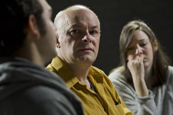 Young man crying from giving his testimony Individual and Family Counseling