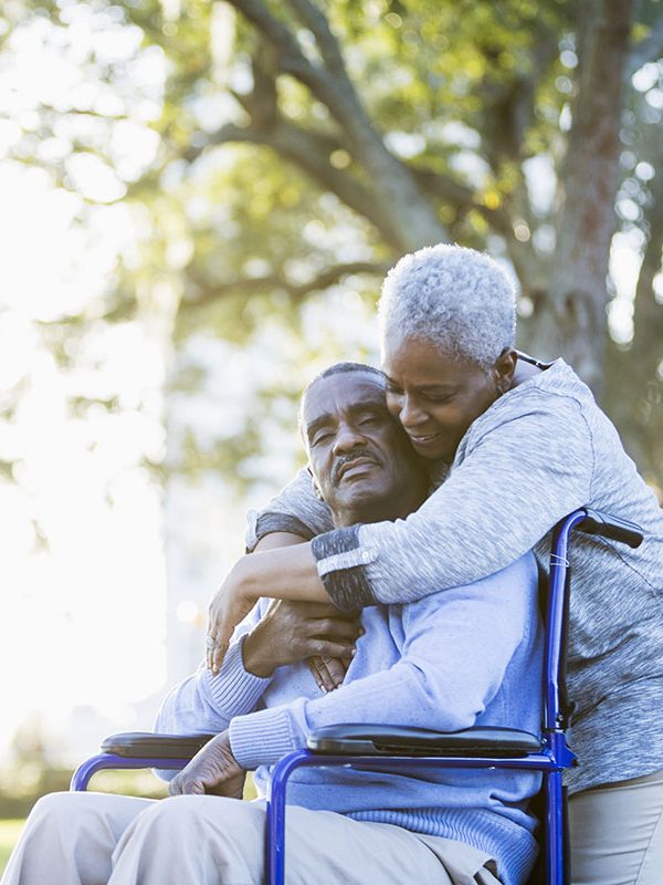 Senior African American couple, man in wheelchair Senior African American couple, man in wheelchair